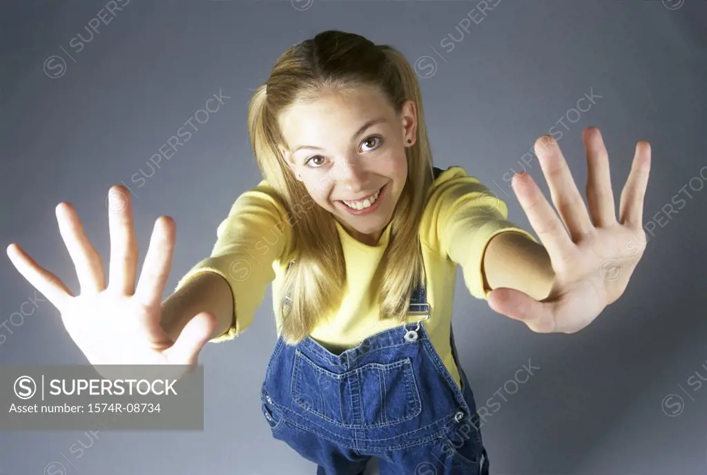 High angle view of a teenage girl with her arms stretched out
