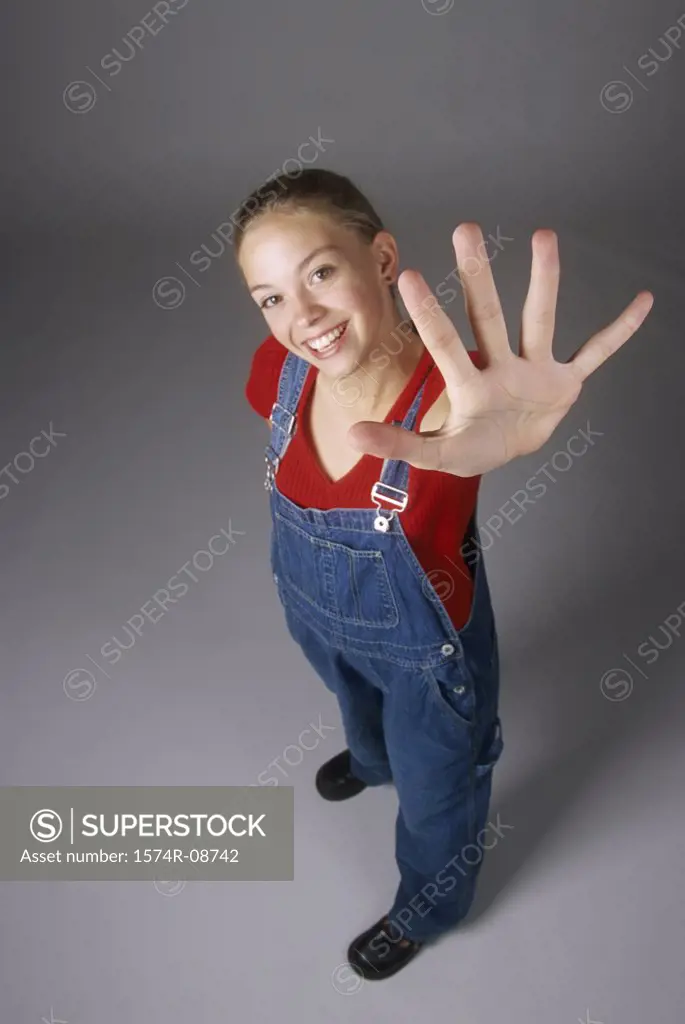 Portrait of a teenage girl with her arm stretched out