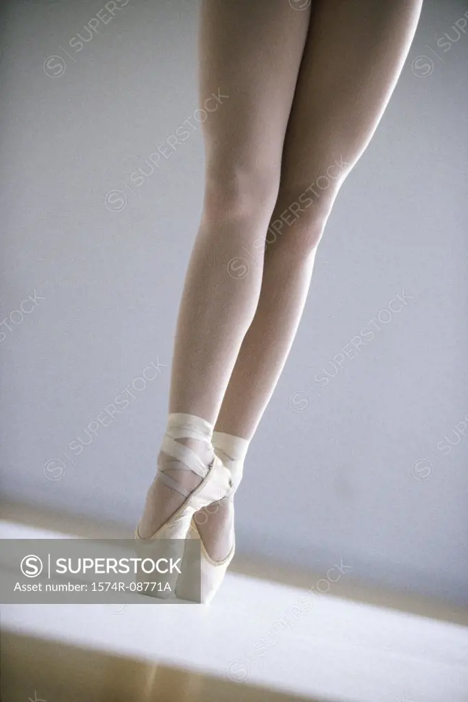 Low section view of a ballerina standing on tiptoe