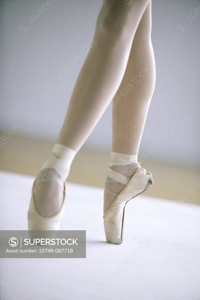 Low section view of a ballerina standing on tiptoe