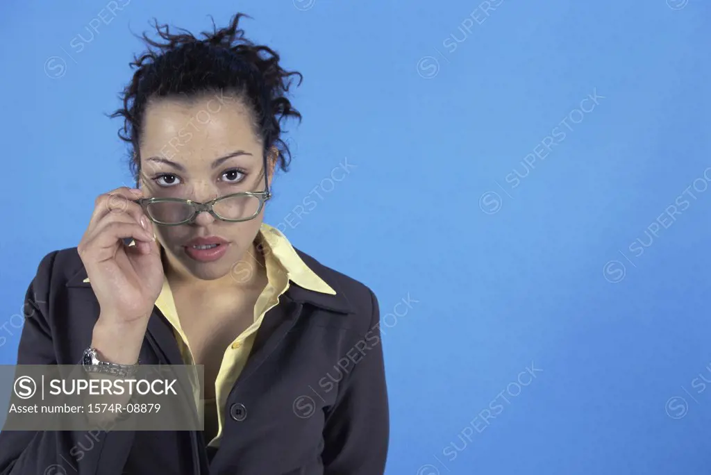 Portrait of a businesswoman adjusting her eyeglasses