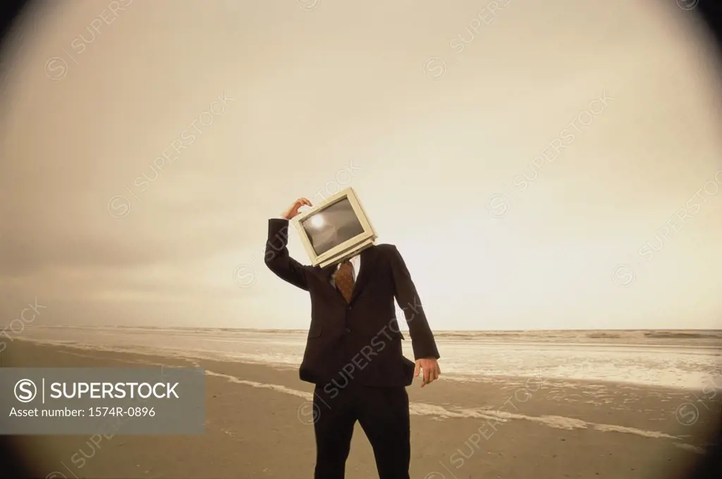 Businessman with a computer monitor for a head
