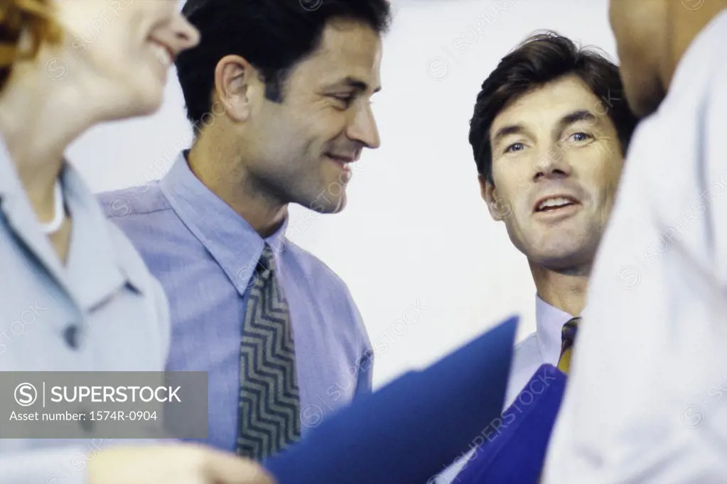 Close-up of a group of business executives talking