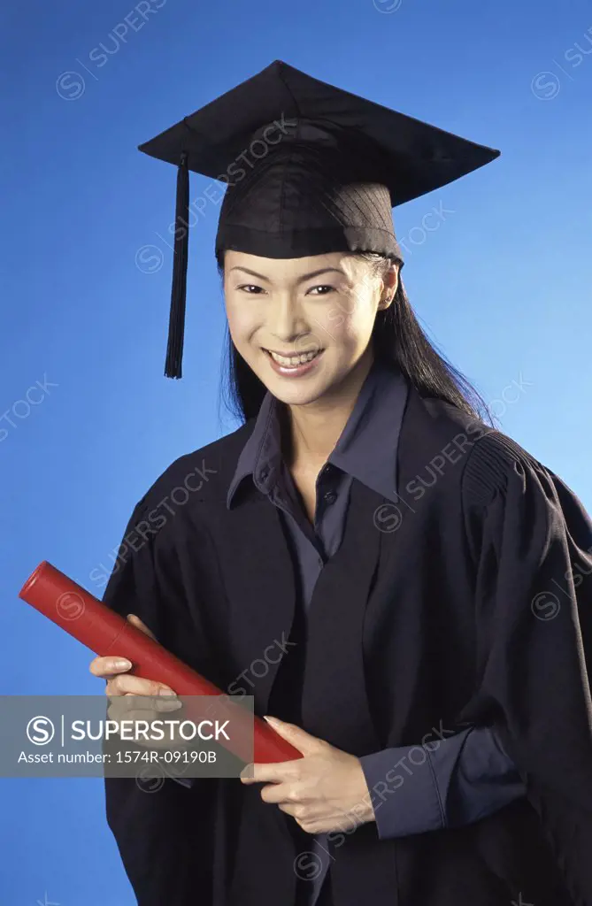 Young female graduate holding a diploma
