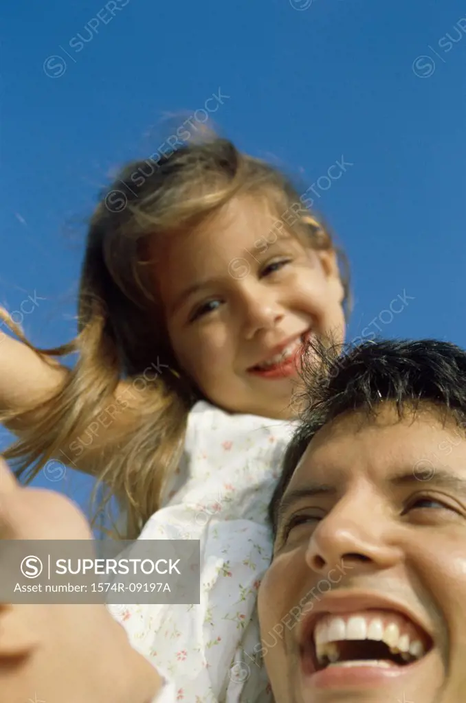 Close-up of a father holding his daughter