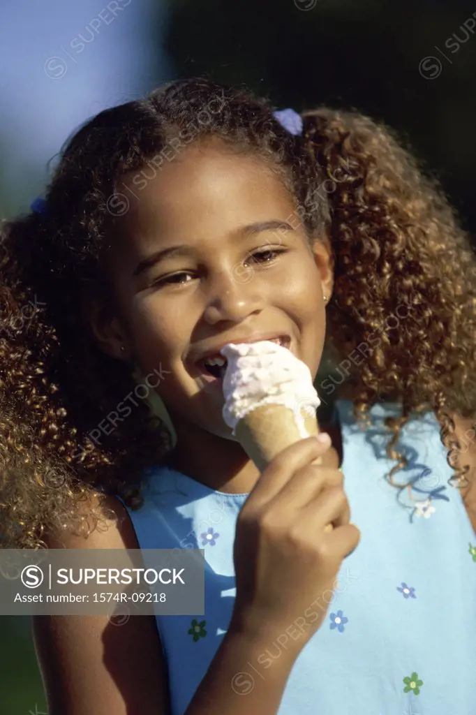 Portrait of a girl eating an ice cream