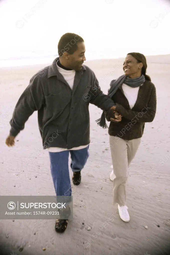 Young couple walking on the beach