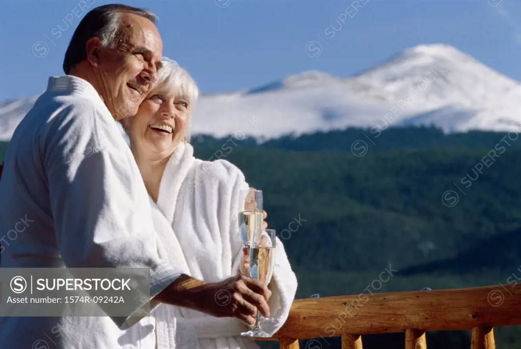 Senior couple holding glasses of champagne