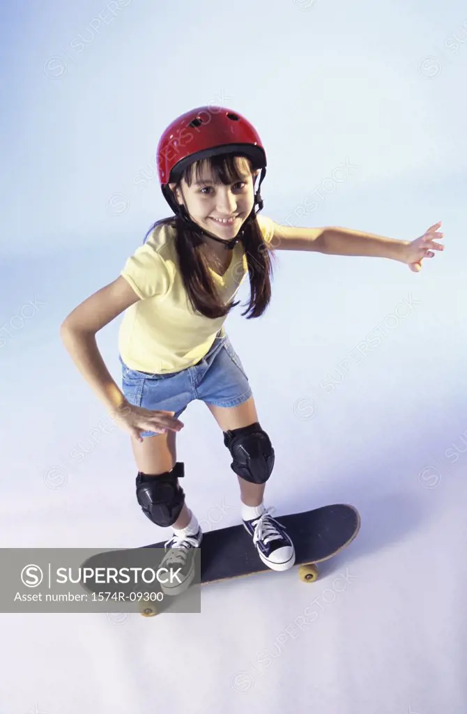 Portrait of a girl riding a skateboard