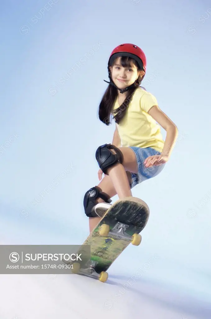 Portrait of a girl riding a skateboard