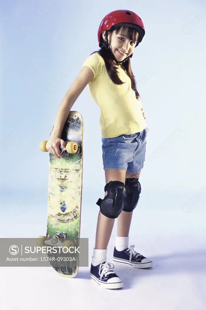 Portrait of a girl holding a skateboard