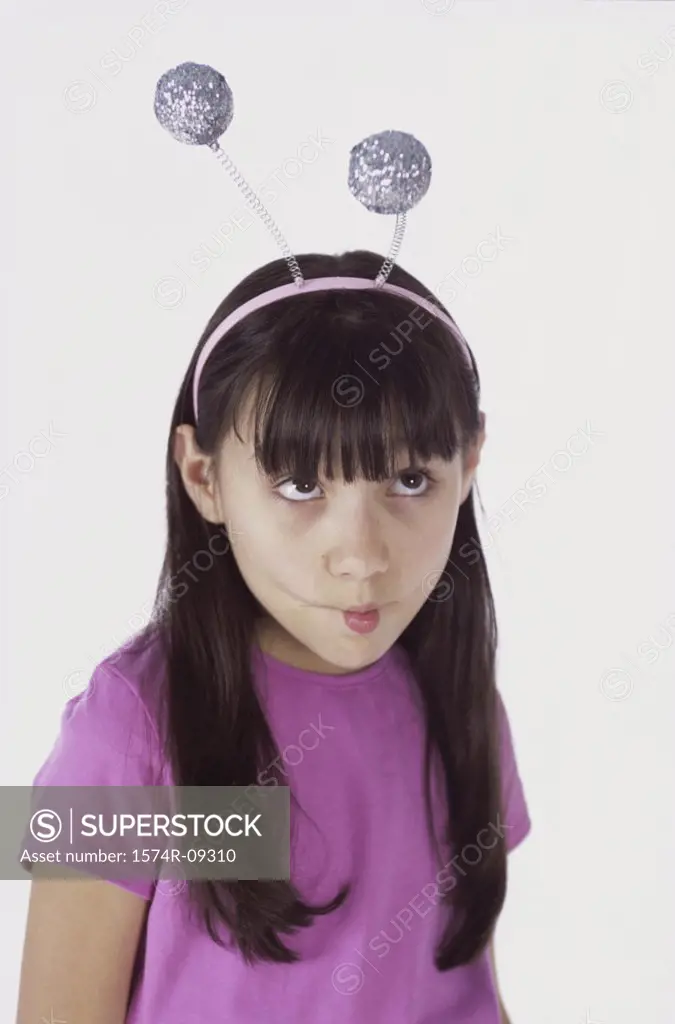 Girl wearing antenna making a face