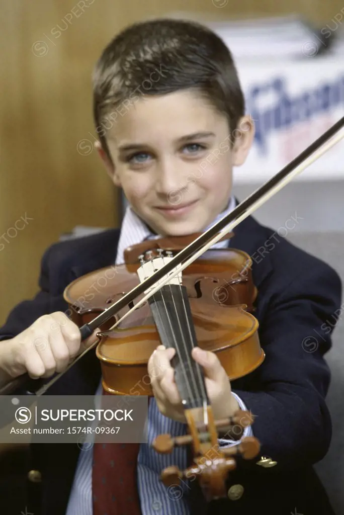 Portrait of a boy playing a violin
