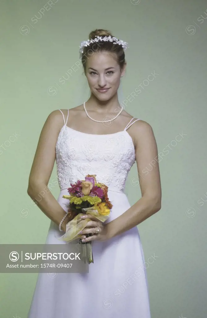 Portrait of a bride holding a bouquet of flowers