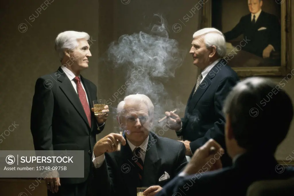 Four businessmen smoking cigars in an office