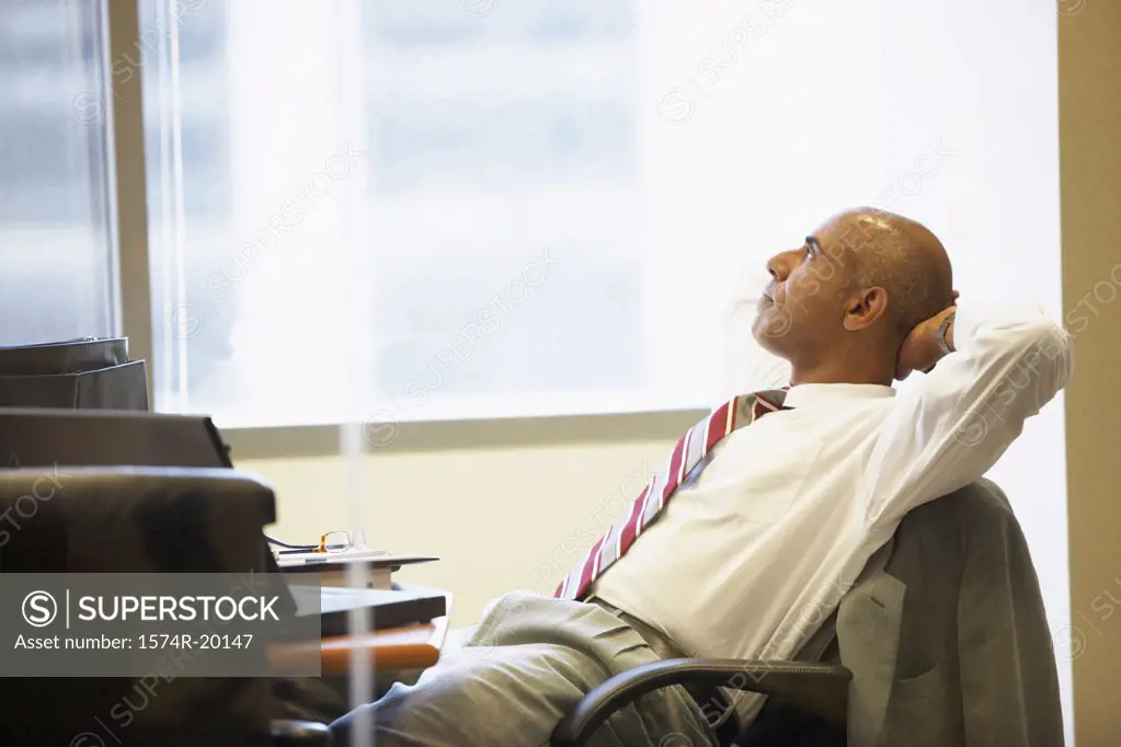 Side profile of a businessman sitting in an office