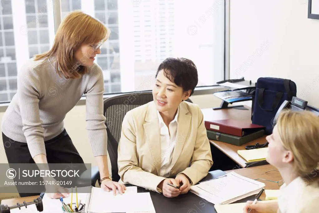 Three businesswomen talking in an office