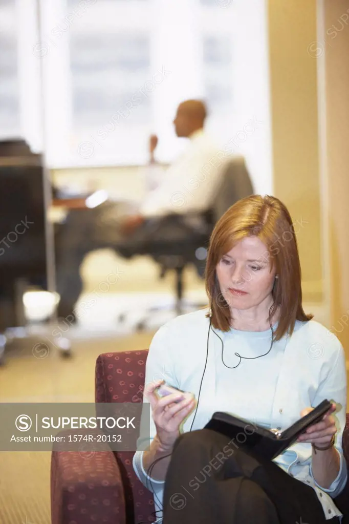 Businesswoman using a mobile phone in an office