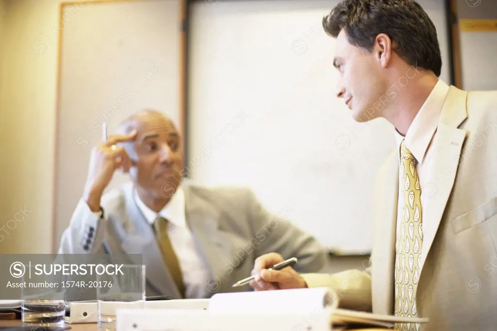 Two businessmen sitting in an office