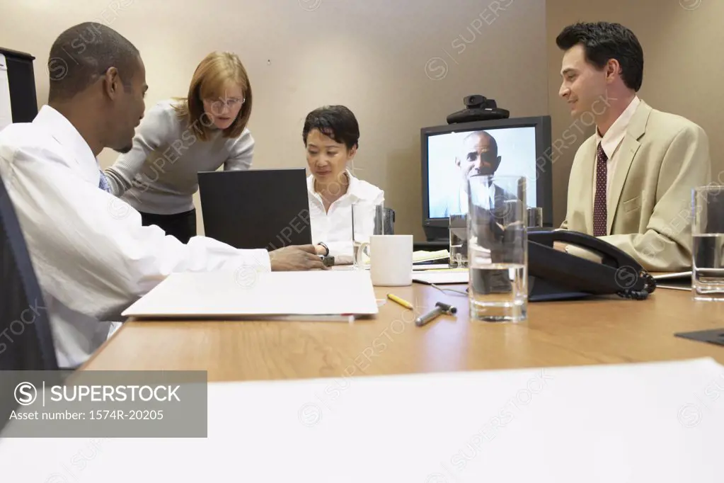 Two businessmen and two businesswomen in a video conference