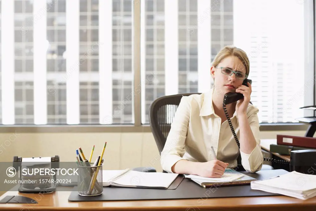 Portrait of a businesswoman talking on the telephone in an office