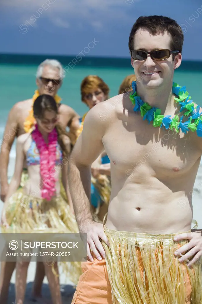 Close-up of a young man smiling on the beach
