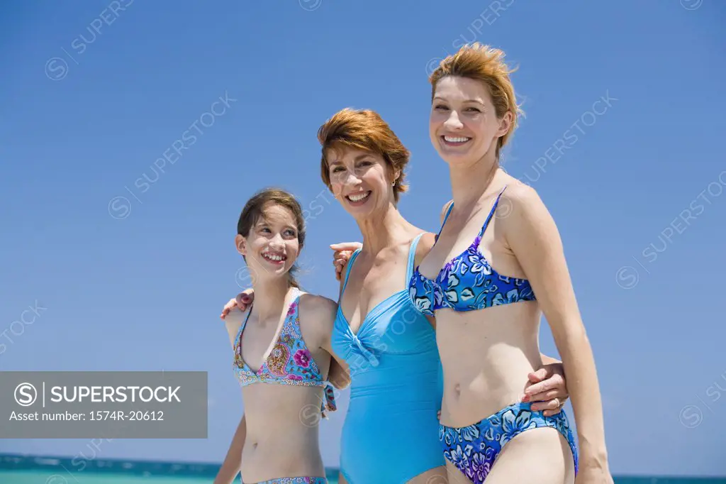 Side profile of a girl standing with her mother and grandmother