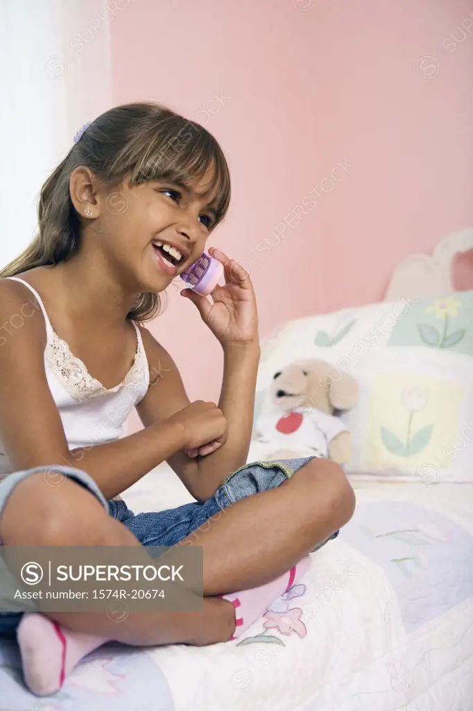 Close-up of a girl talking on a mobile phone