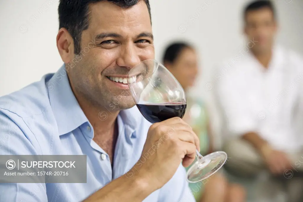 Portrait of a mature man drinking red wine