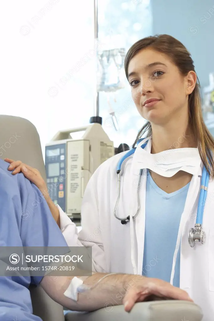 Portrait of a female doctor examining a male patient