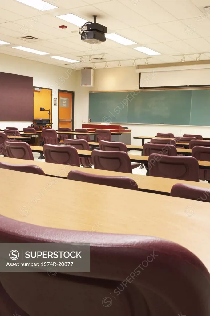 Empty tables and chairs in a lecture hall