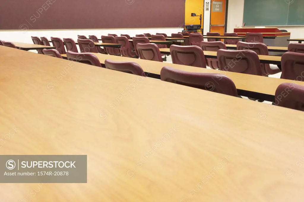 Empty tables and chairs in a lecture hall