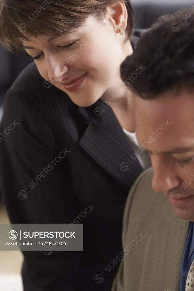 Close-up of a businessman with a businesswoman