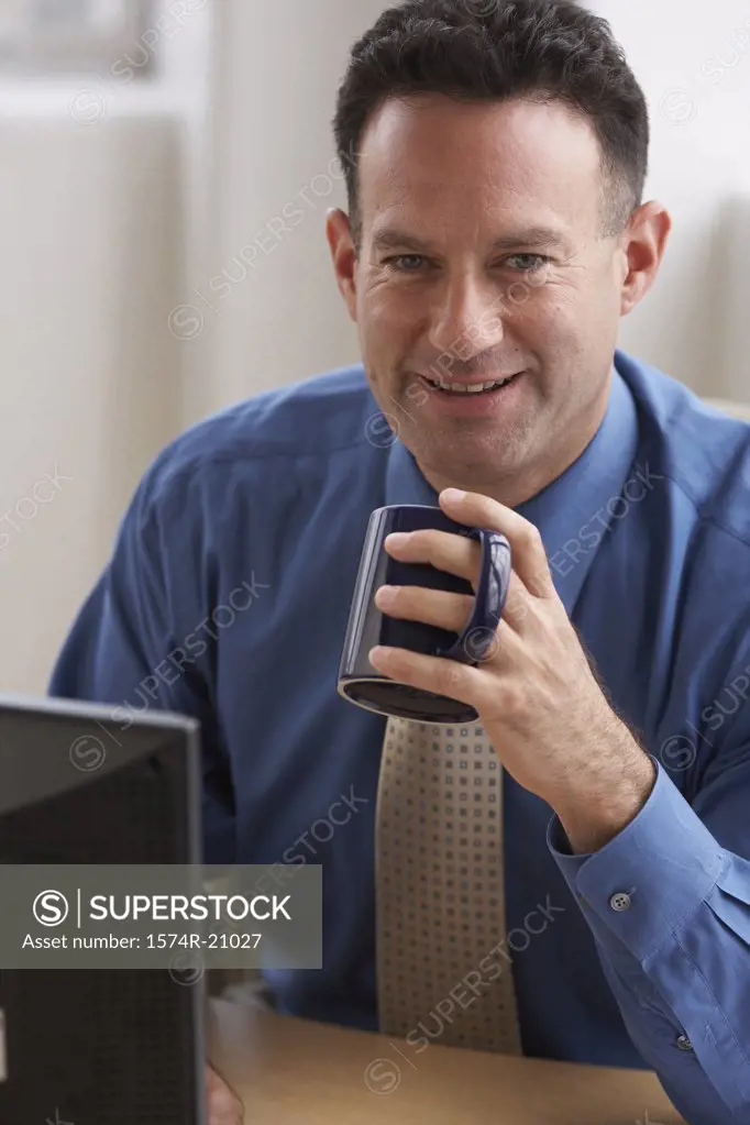 Portrait of a businessman holding a coffee cup