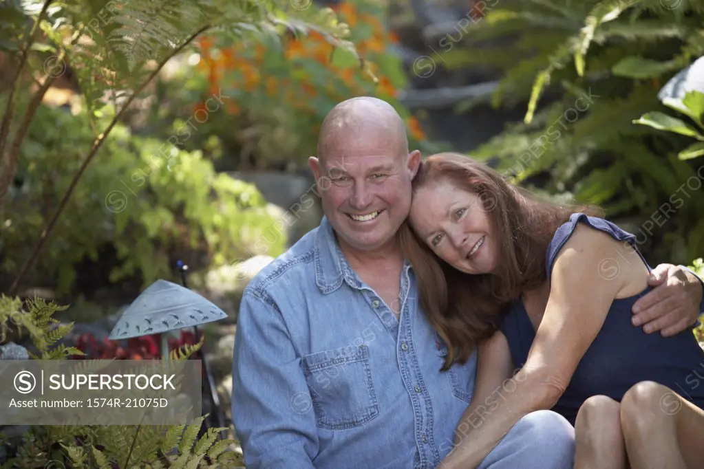 Portrait of a mature couple smiling in a garden