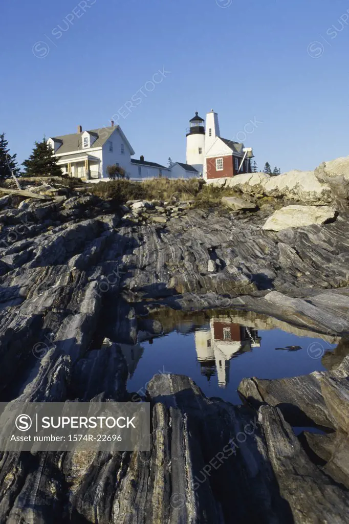 Reflection of a lighthouse in water, Pemaquid Point Lighthouse, Pemaquid Point, Maine, USA