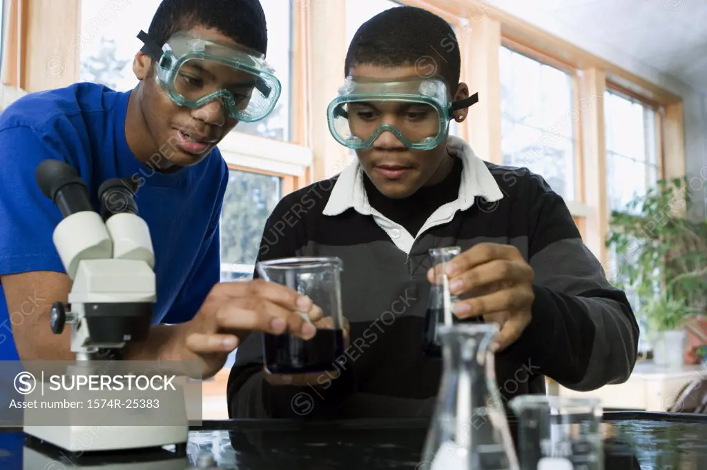 Two student performing an experiment in a science lab