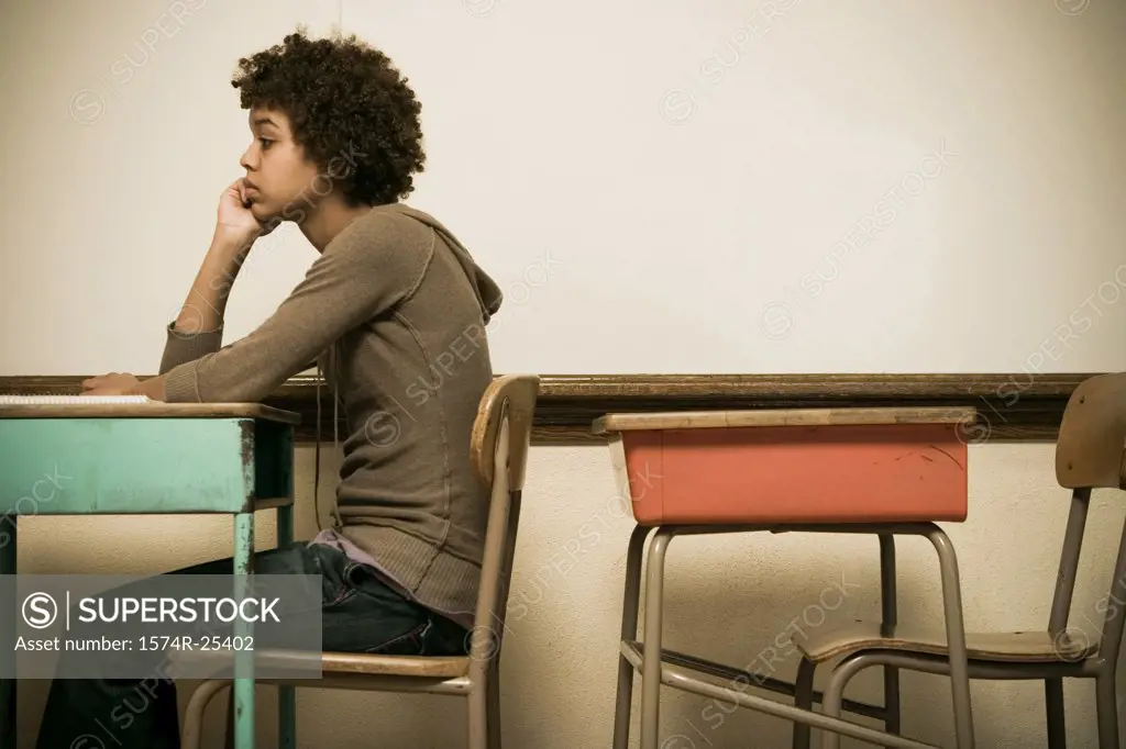 Student sitting at a desk in a classroom