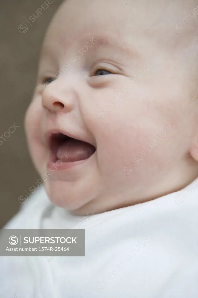 Close-up of a baby laughing