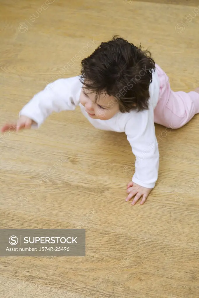 High angle view of a baby girl crawling