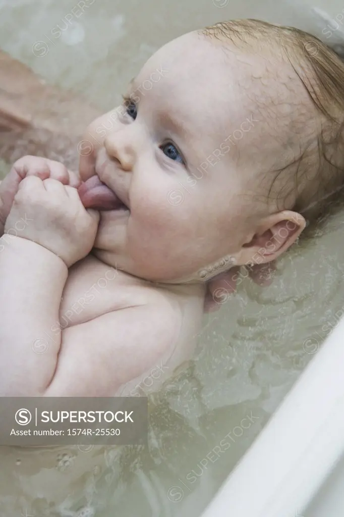 High angle view of a baby taking a bath