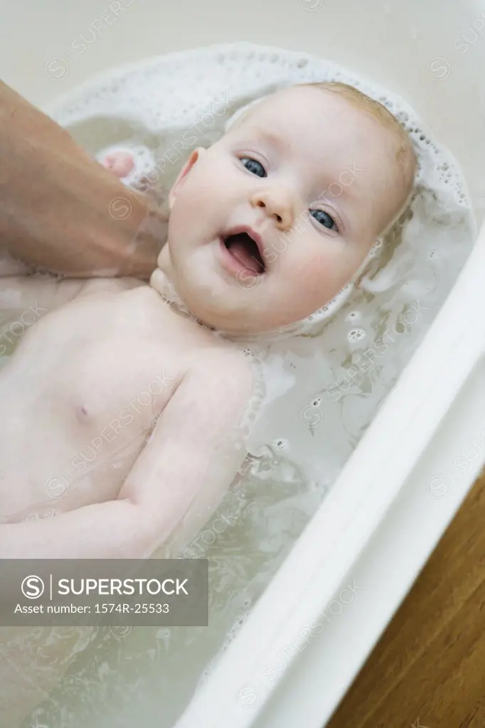 High angle view of a baby taking a bath