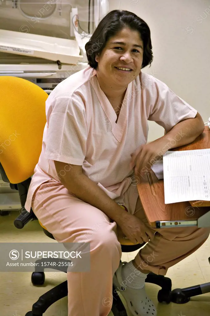 Female nurse sitting on a chair and smiling
