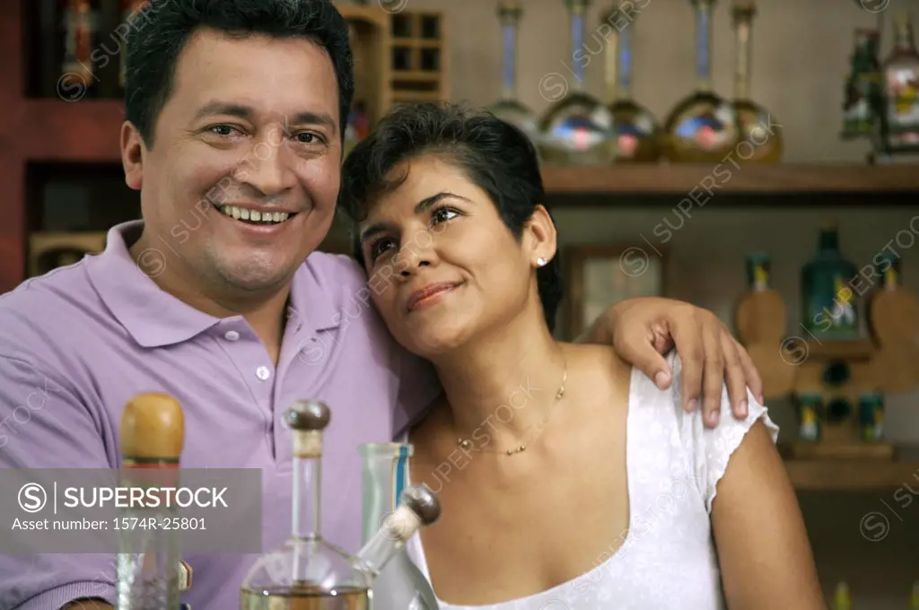 Mature couple smiling in a cafe
