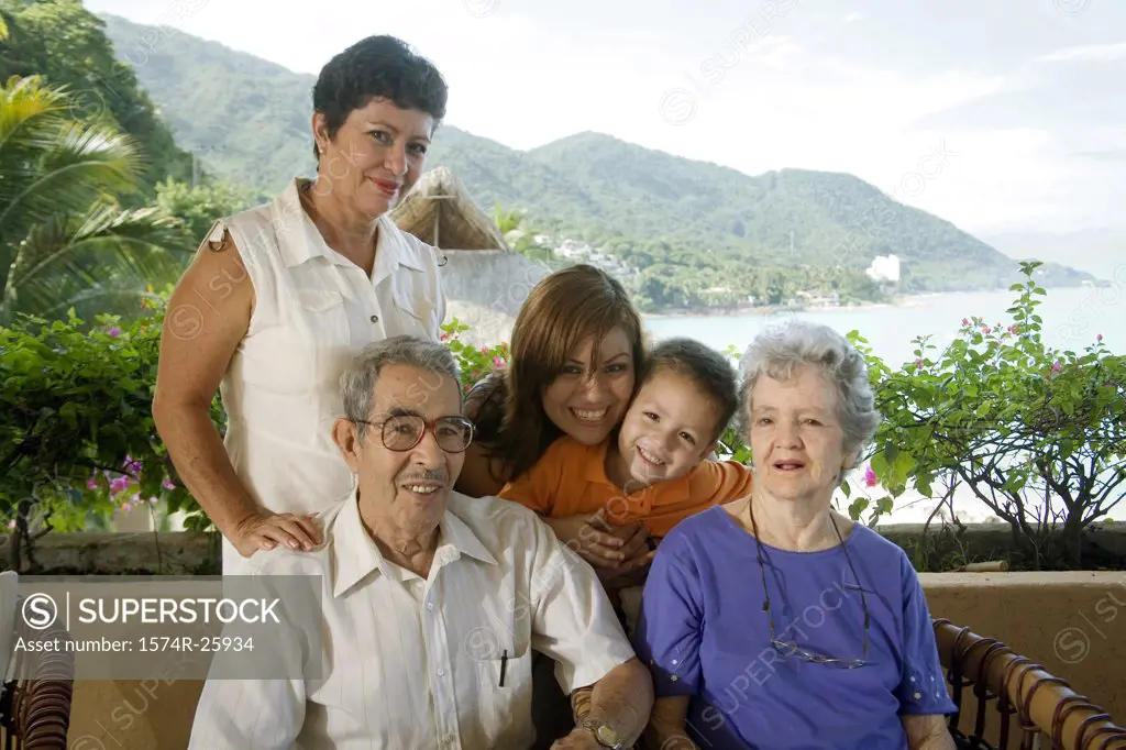 Senior couple with their family smiling