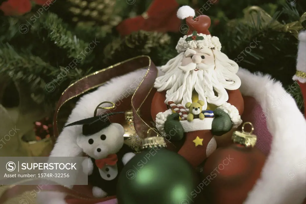 Toys and Christmas ornaments in a Santa hat