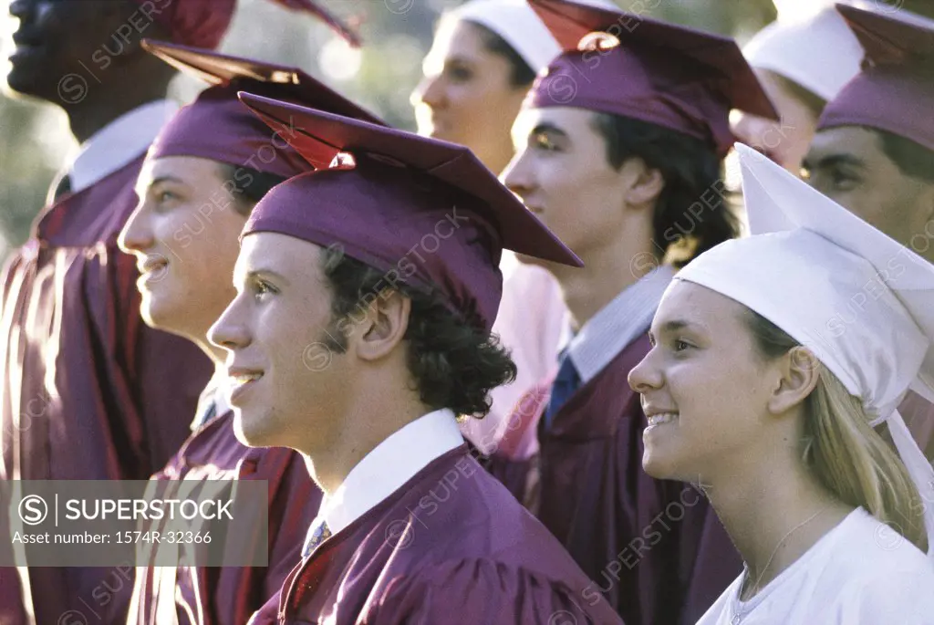 Side profile of a group of young graduates