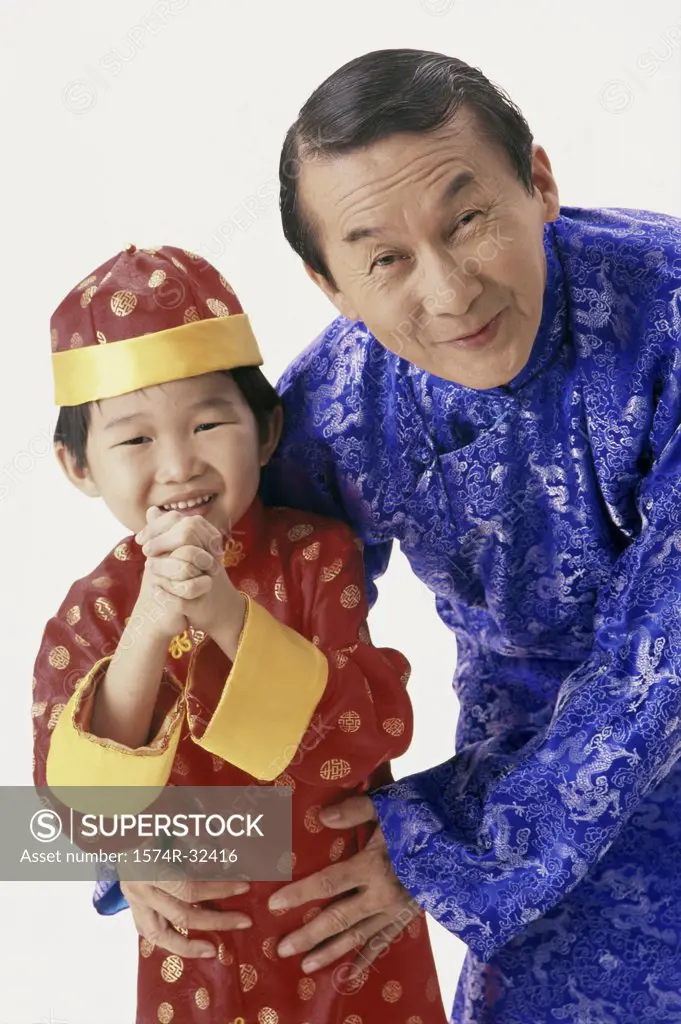 Portrait of a father and his son in traditional clothing