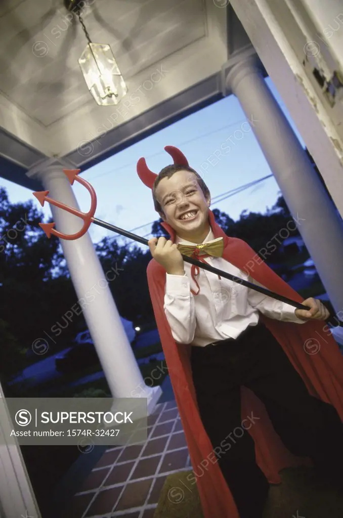 Boy wearing a devil costume for Halloween