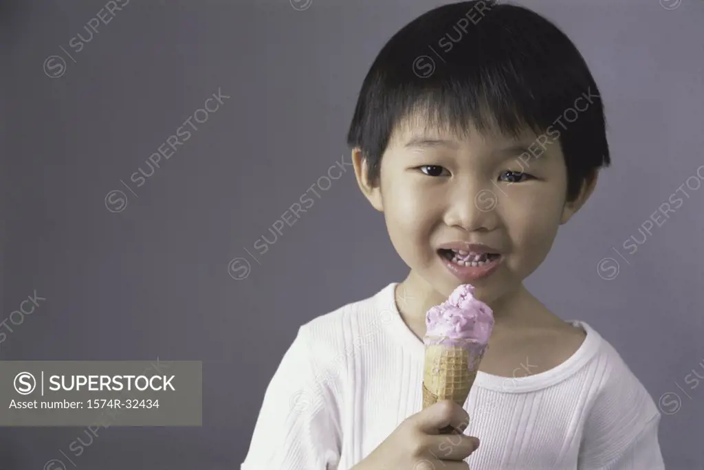 Portrait of a boy eating an ice cream cone